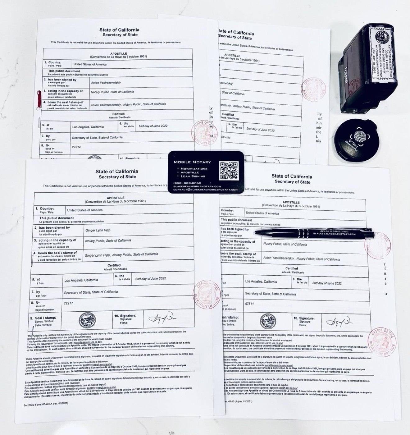 A completed California Secretary of State apostille next to a Black Seal Mobile Notary card